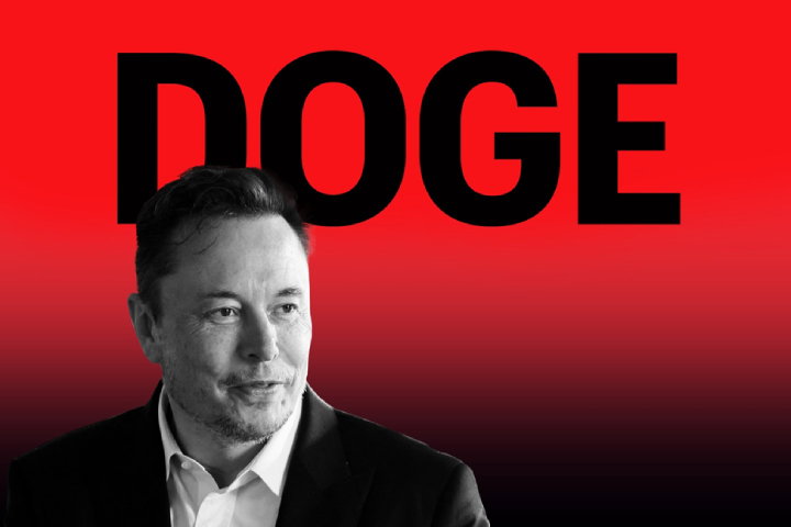 TechDogs-"An Image Showing Elon Musk With DOGE Written In The Background"